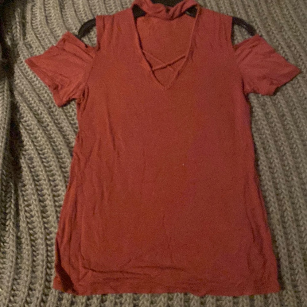 This is a cold shoulder and deep v neck blouse made by the brand snap!